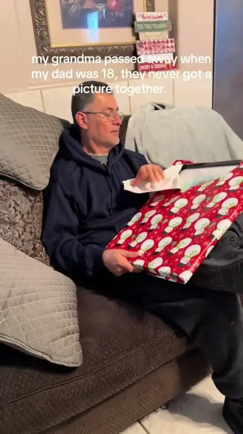 A customer opening their portrait on camera.